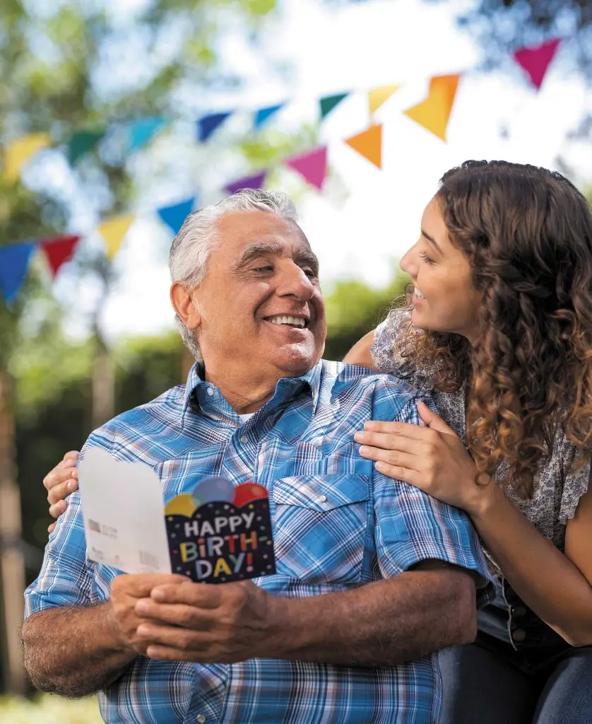 Young woman wishes her dad happy birthday.